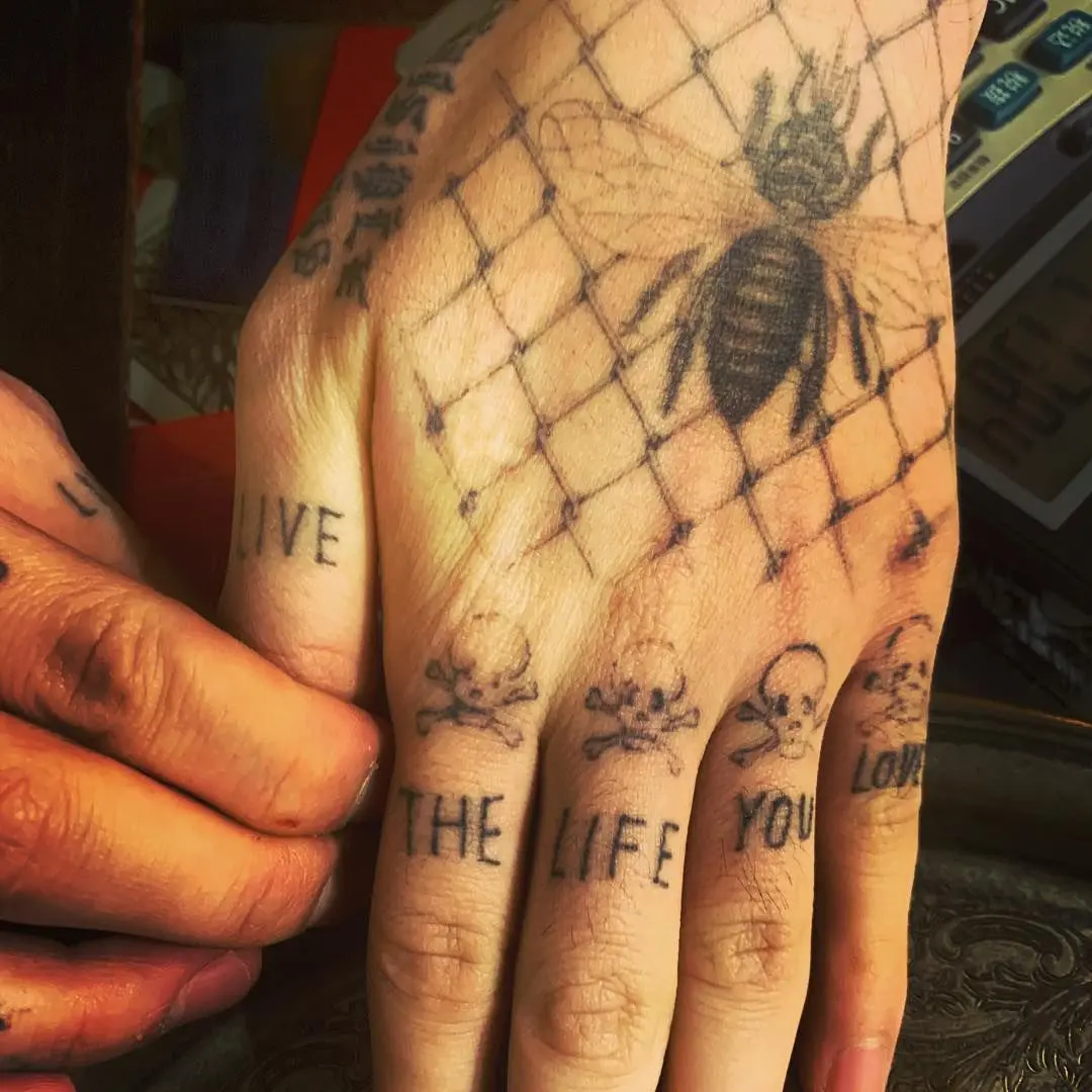 norman reedus tattoo on wrist